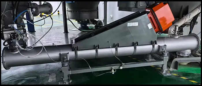 Stainless steel vibrating feeder conveying grain in food processing line
